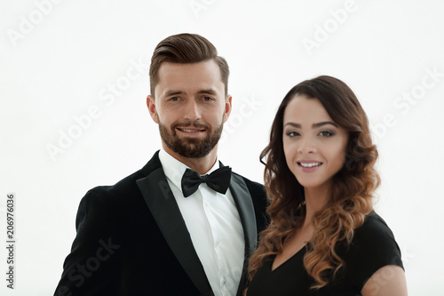 Portrait of a handsome man looking at the camera with a woman