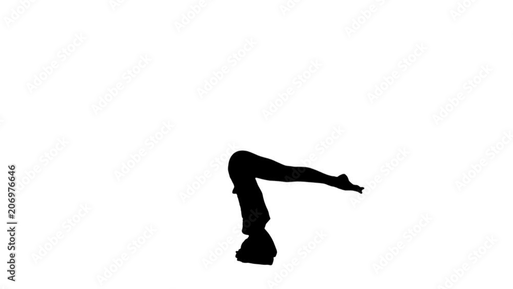 Young woman doing sirsasana yoga pose track matte Young woman doing sirsasana yoga pose track matte