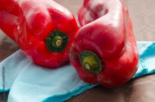 red peppers, on table with brown tablecloth