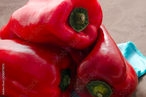 red peppers, on table with brown tablecloth