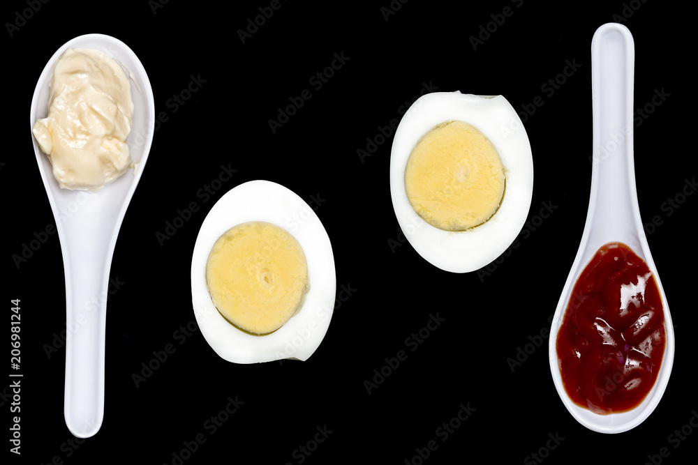 boiled egg with spoons with mayonnaise and ketchup boiled egg with spoons with mayonnaise and ketchup