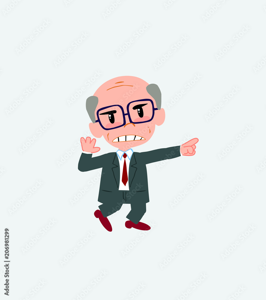 Old businessman with glasses points angrily to his left. Old businessman with glasses points angrily to his left.