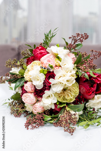 Fototapeta Naklejka Na Ścianę i Meble -  beautiful modern wedding bouquet on white table