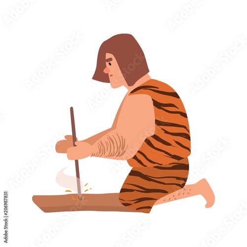 Primitive archaic man or caveman dressed in skin clothes lighting fire through friction by grinding piece of wood or hand drilling