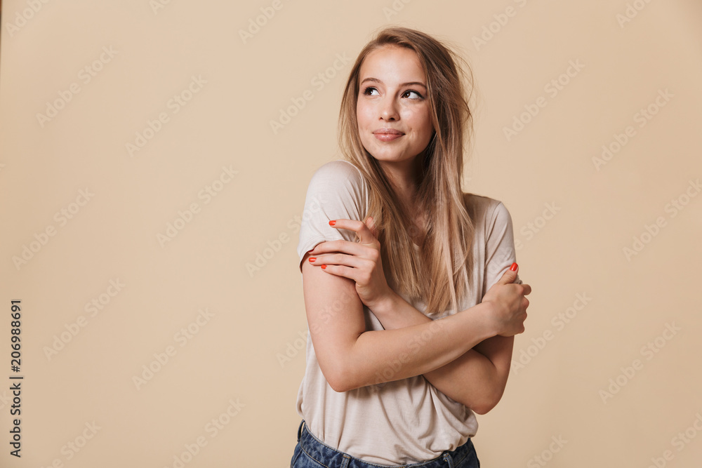 Portrait of a smiling casual girl looking away Portrait of a smiling casual girl looking away