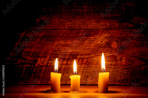Background with candle light on wooden board at the night © 279photo