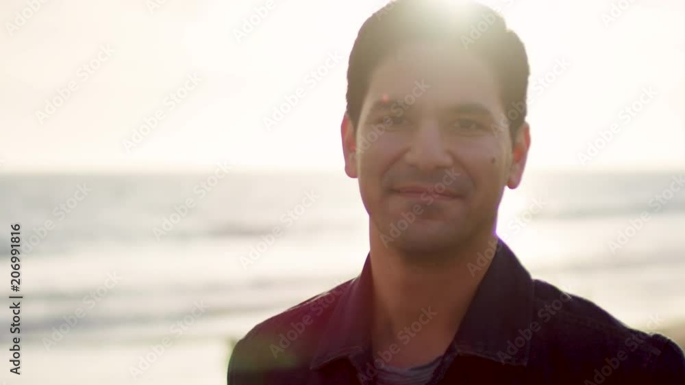 Portrait Of Man Smiling On Venice Beach Pier, At Sunset (Slow Motion) Portrait Of Man Smiling On Venice Beach Pier, At Sunset (Slow Motion)