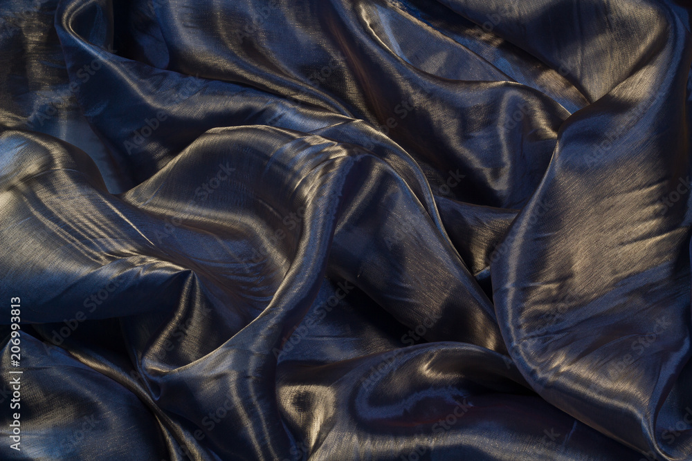 Fototapeta premium Smooth elegant blue silk. To be used as background.