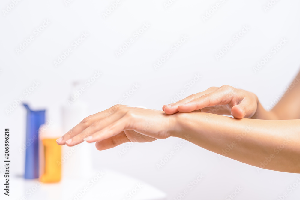UV Protection Body Lotion Skin Care Apply. women hands holding UV protection body cream bottle. Beauty And Body Care Concept UV Protection Body Lotion Skin Care Apply. women hands holding UV protection body cream bottle. Beauty And Body Care Concept