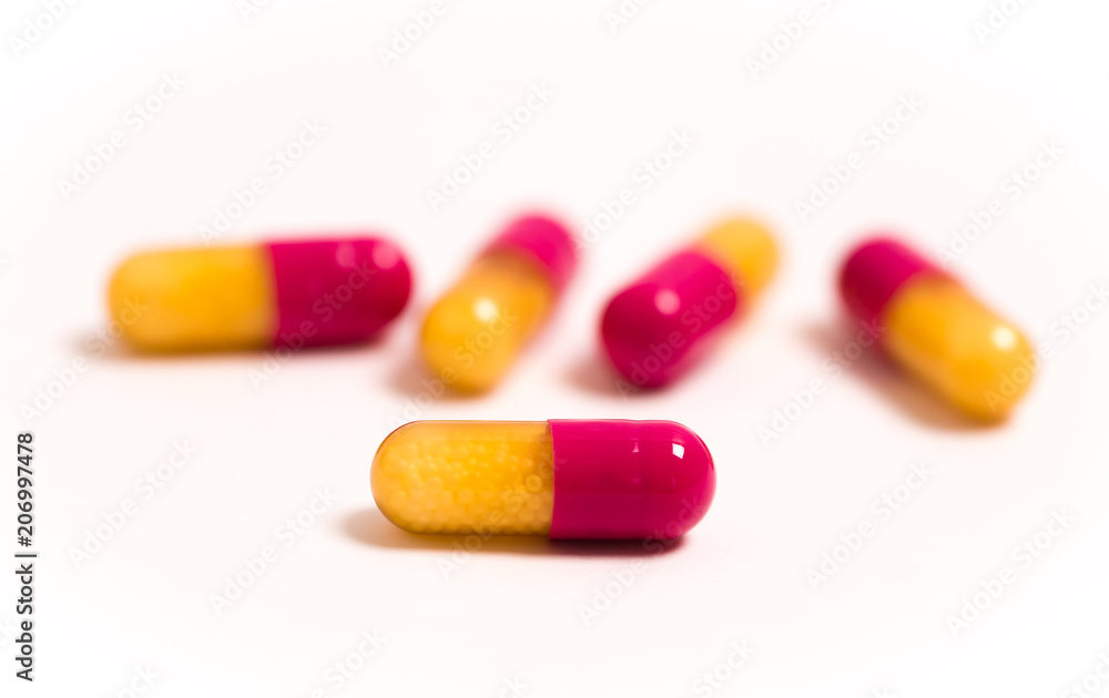 Tablets and capsules isolated on a white background a variety of medicinal medications for female and male health, biodegradable supplements and vitamins for heart health and contraceptives Tablets and capsules isolated on a white background a variety of medicinal medications for female and male health, biodegradable supplements and vitamins for heart health and contraceptives