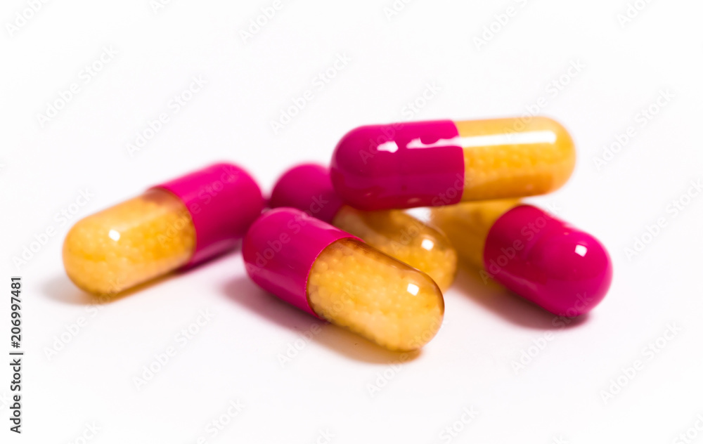 Tablets and capsules isolated on a white background a variety of medicinal medications for female and male health, biodegradable supplements and vitamins for heart health and contraceptives Tablets and capsules isolated on a white background a variety of medicinal medications for female and male health, biodegradable supplements and vitamins for heart health and contraceptives