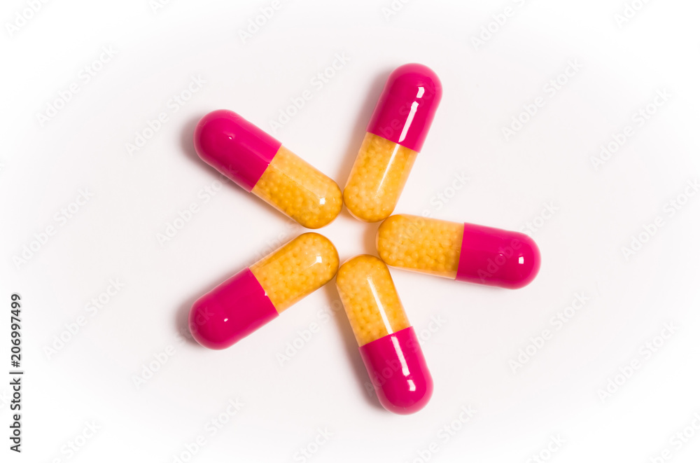 Tablets and capsules isolated on a white background a variety of medicinal medications for female and male health, biodegradable supplements and vitamins for heart health and contraceptives Tablets and capsules isolated on a white background a variety of medicinal medications for female and male health, biodegradable supplements and vitamins for heart health and contraceptives