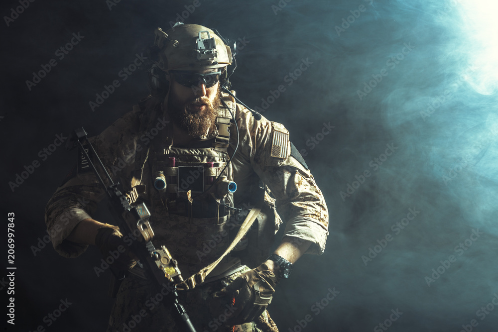 © fotofabrika - Special forces soldier with rifle on dark background © fotofabrika - Special forces soldier with rifle on dark background