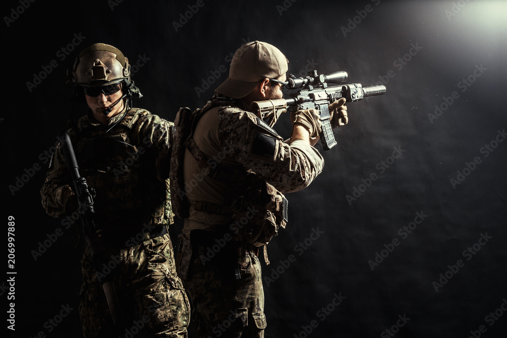 Group of security forces in Combat Uniforms with rifles Group of security forces in Combat Uniforms with rifles