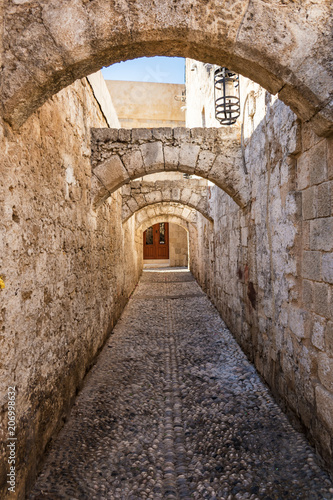 Narrow medieval street of old town in City of Rhodes  Rhodes  Greece 