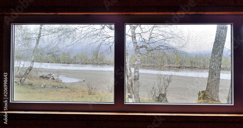 view from the window to the river on a rainy day