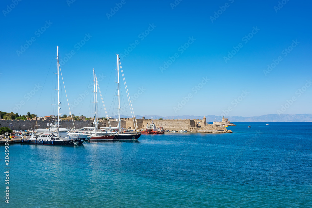 Boats in front of city walls in City of Rhodes (Rhodes, Greece)