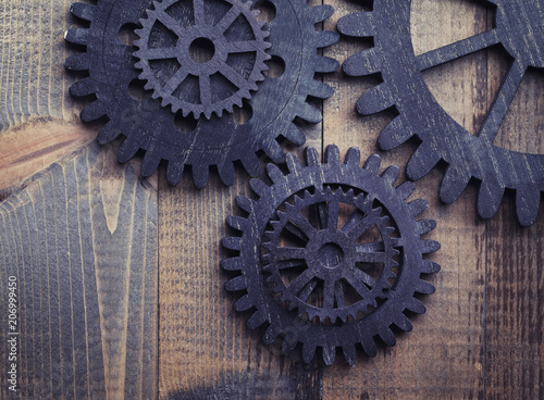 Wooden rustic gears on grunge background
