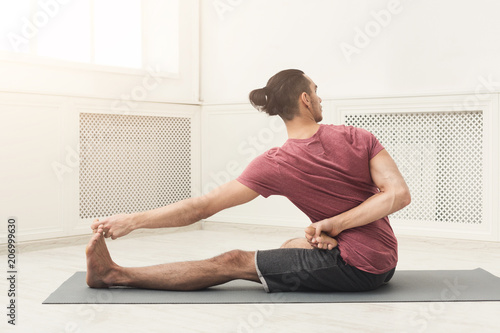 Fitness man at legs stretching training