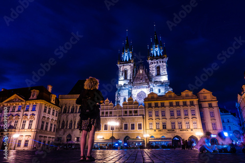 Girl watching on the main square in Prague city
