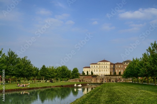 Venaria reale, Piedmont region, Italy. June 2017. The landscape of the gardens of the royal palace of Venaria. Vision from the ruins of the temple of Diana towards the palace. Tourists.