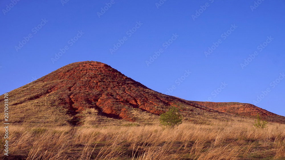 Hills of red sand, clay Hills of red sand, clay