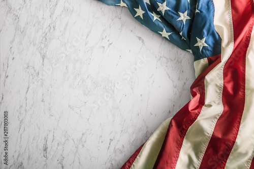 Close-up american flag on white marble background