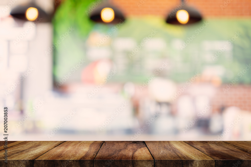 wood table with blurred interior in cafe background. wood table with blurred interior in cafe background.