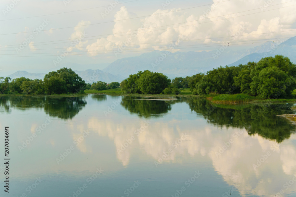 Scenic summer landscape of the tranquil waters of The Lake of Shkodra, Albania
