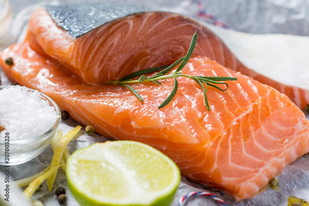 Salmon Fillet with Lime and Aromatic Herbs and Spices on White Paper