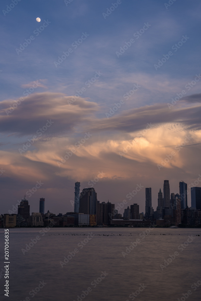 Amazing sky behind New York City skyline viewed from Hoboken, New Jersey