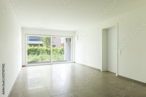 Empty room in a modern apartment with white walls  nobody in the scene