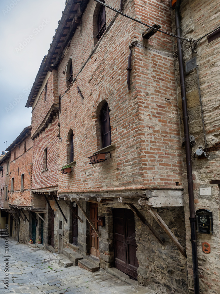 Medieval homes built on the city walls in Cortona, Tuscany Medieval homes built on the city walls in Cortona, Tuscany