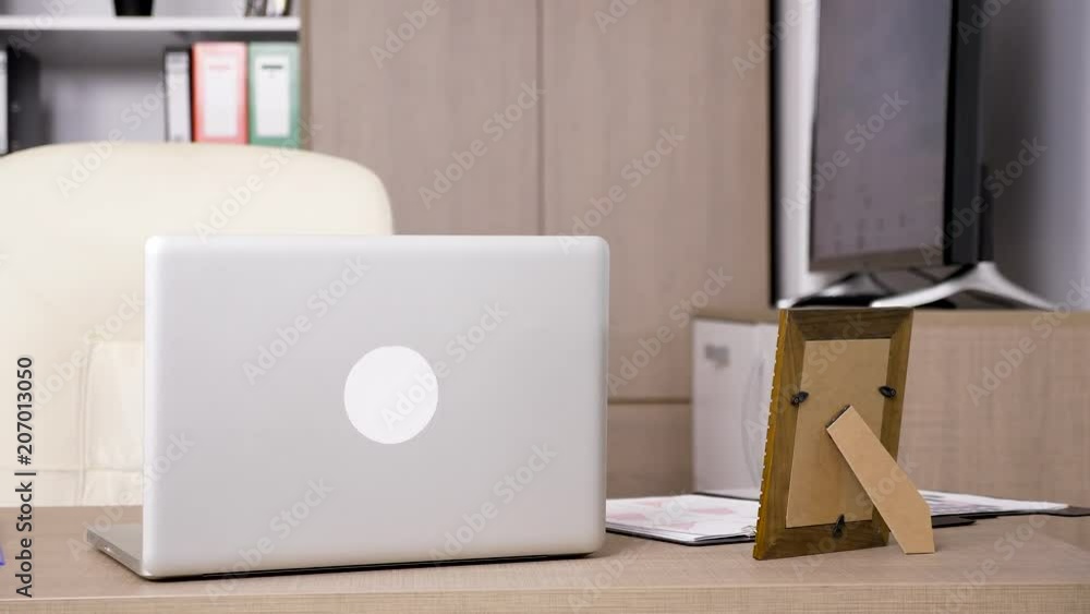 Modern office interior with a premium laptop on the desk. Dolly parallax footage Modern office interior with a premium laptop on the desk. Dolly parallax footage