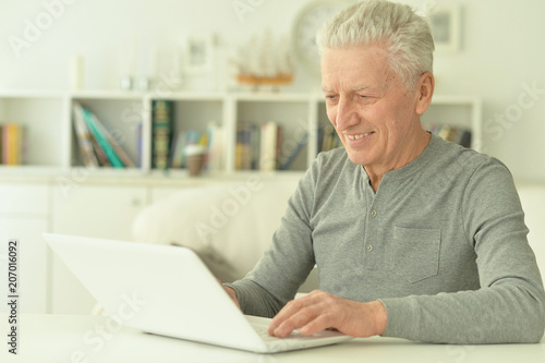  senior man using laptop 