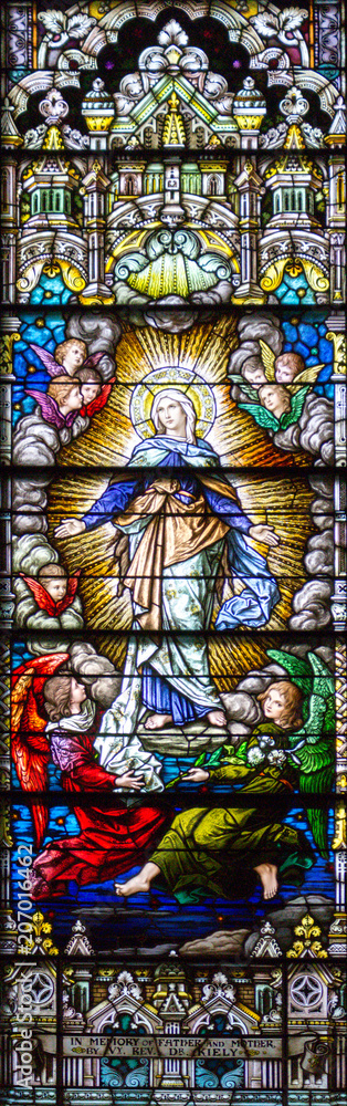 Salt Lake City, Utah, US. 31/08/2017. Stained glass in The Cathedral of the Madeleine depicting the Assumption of Virgin Mary into heaven.