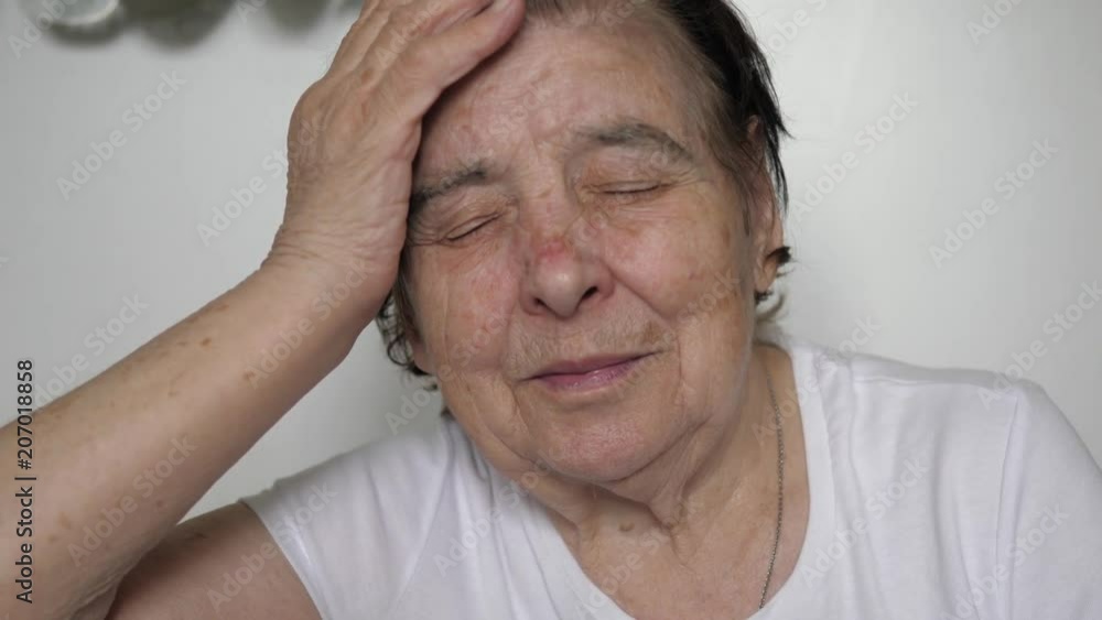 An Elderly Woman Is Having A Severe Headache An Elderly Woman Is Having A Severe Headache