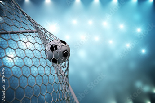 Fototapeta Naklejka Na Ścianę i Meble -  3d rendering soccer ball in goal. Soccer ball in net with spotlight and stadium light background, Success concept. Soccer ball on blue background.