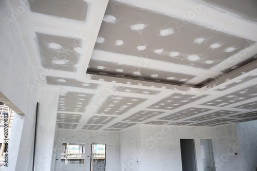Canvas-taulu ceiling gypsum board installation at construction site