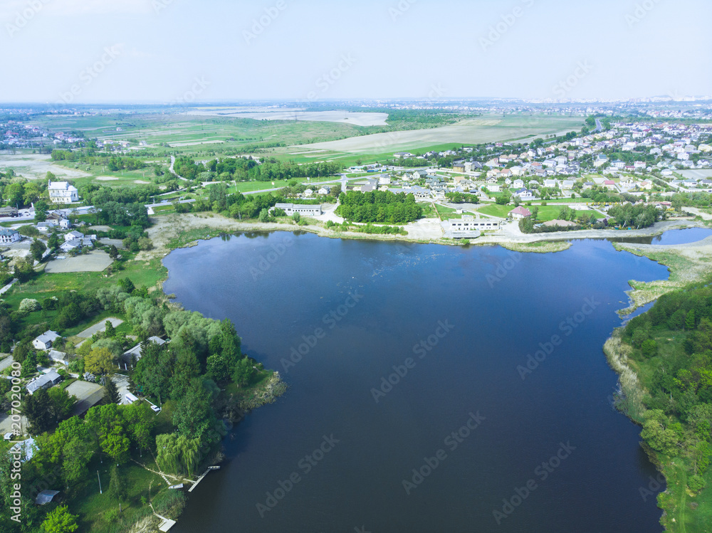 aerial view of river. small town on background
