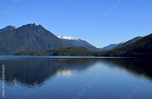 view across the Kennedy Lake, towards the mountains of the Clayoquot Plateau on Vancouver Island, British Columbia Canada
