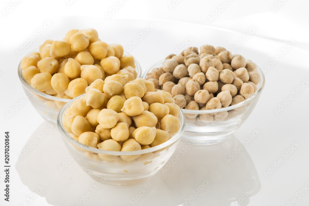 Chickpea grains (Cicer arietinum) in bowl isolated on white background Chickpea grains (Cicer arietinum) in bowl isolated on white background