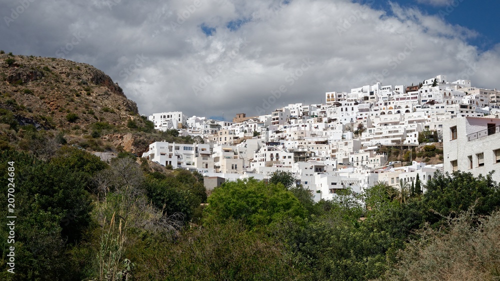 White spanish village perched on the slope of a hill