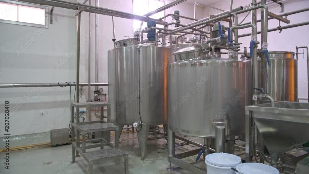 Factory boilers. Slider dolly shot of small factory boilers. Made from steel, natural lights. Factory boilers. Slider dolly shot of small factory boilers. Made from steel, natural lights.