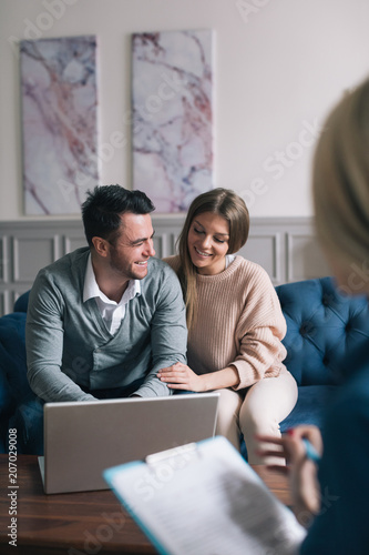Family meeting real-estate agent for house investment.