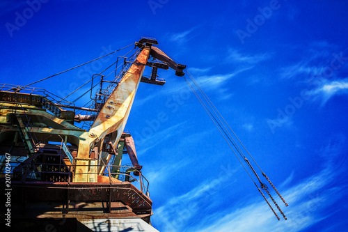 Old rusty abandoned port cranes photo