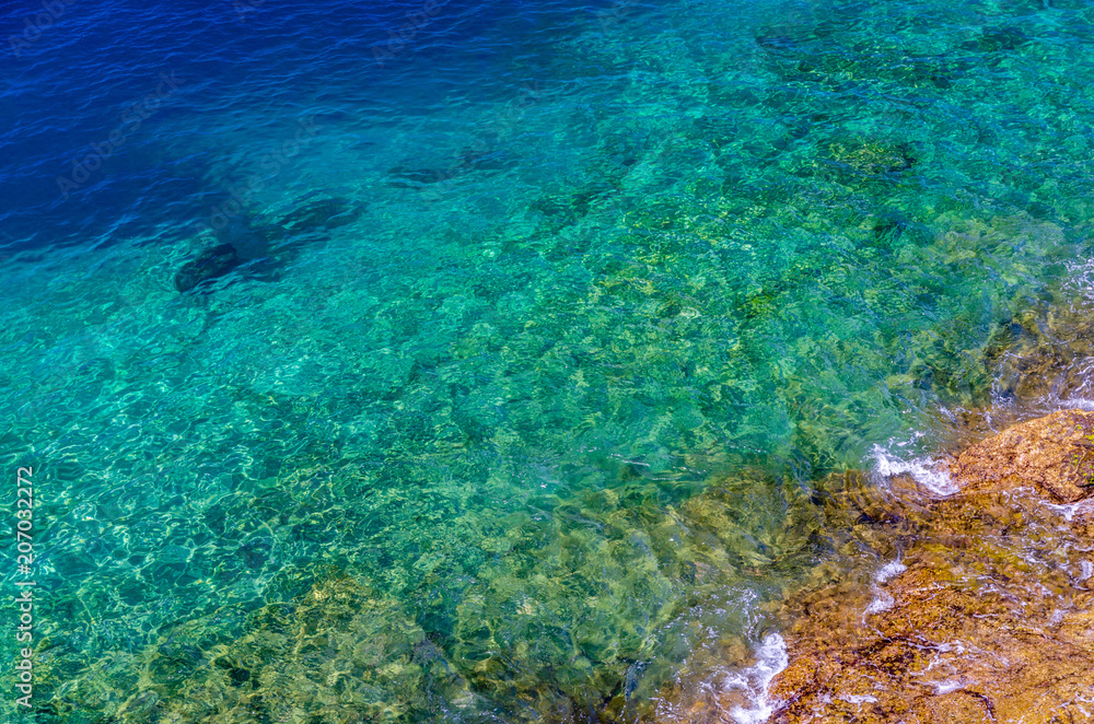 Obraz premium Crystal clear blue sea with rocks on the bottom, Gran Canaria, Canary Islands, Spain