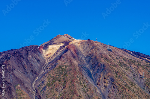 A close-up of the El Teide mountain summit on a sunny day with blue sky, Tenerife, Canary Islands, Spain