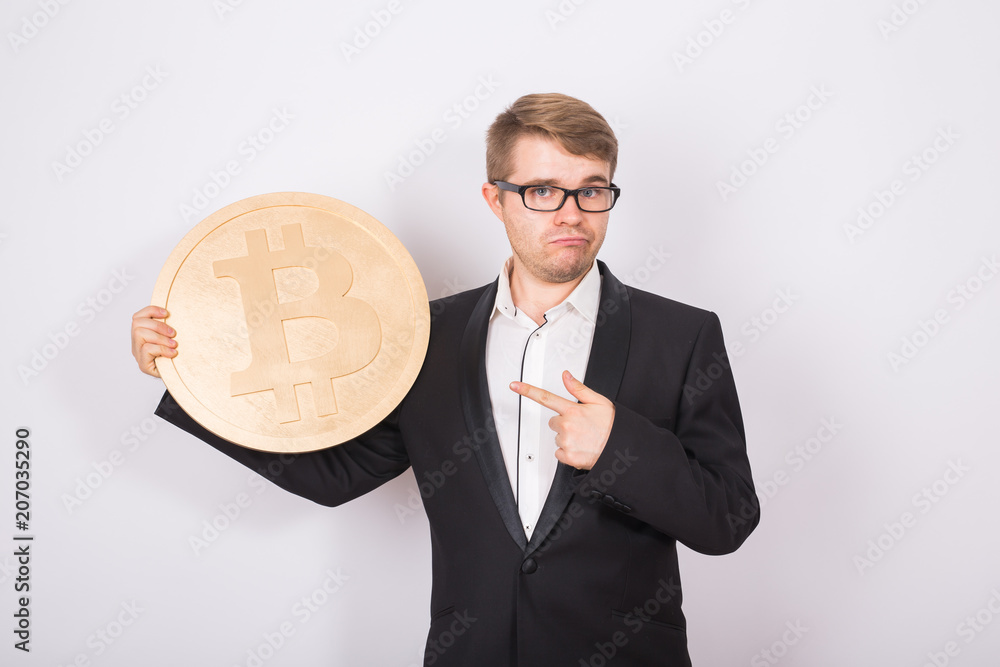Businessman holding bitcoin on white background Businessman holding bitcoin on white background