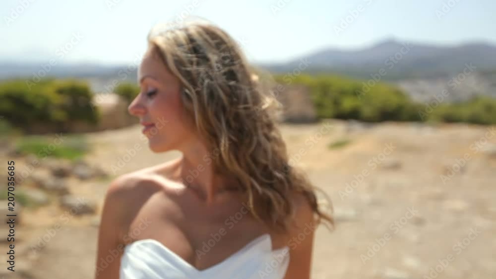 Wedding photosession of the newlyweds in Greece. Loving couple on the beach. slow motion Wedding photosession of the newlyweds in Greece. Loving couple on the beach. slow motion